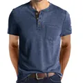 Men's blue short-sleeved Henley T-shirt featuring a chest pocket and soft cotton texture. - Dark Blue