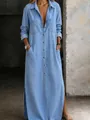 Detailed view of long light blue denim shirt dress featuring buttons and side slits - S / Dresses / Light Blue