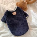 Close-up detail of a cozy navy blue fleece dog sweater featuring a cute embroidered bear patch - XS / Navy Blue