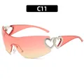 Trendy Y2K rimless sunglasses for women featuring heart cutouts and orange gradient lenses - Pink Frame Pink Yellow Gradient Lens