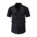 Premium black short-sleeved casual shirt for men featuring unique wave crinkle patterns - XS / Tops / Black