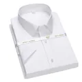 Detailed view of a folded white non-iron cotton business shirt with ribbon packaging - 38 / Tops / T-Shirts / White