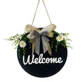 Detailed view of black round welcome sign with burlap bow and white daisy decor - Blue Ribbon Welcome Style