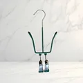 Detailed close-up showing the green coated frame and metal clips of the shoe drying rack - 1 Piece / Luxury Green