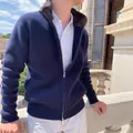 Men's navy blue ribbed zip-up cardigan with brown faux fur collar in outdoor setting. - S / Tops / Dark Blue