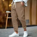 Detail of men's brown cotton linen joggers with drawstring waist and cuffed ankles - S / Camel