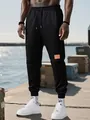 Pantalones deportivos de forro polar negro para hombre con zapatillas blancas al aire - XS / Bottoms / Negro
