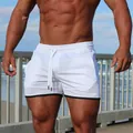 Vista dettagliata dei pantaloncini sportivi bianchi da uomo con coulisse e bordo nero. - Taglia M / Pantaloni e gonne / Bianco