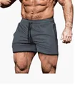 Dettaglio ravvicinato di pantaloncini sportivi grigi traspiranti con coulisse regolabile - Taglia M / Pantaloni e gonne / Grigio