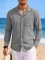 Detail of men's grey cotton linen long sleeve shirt with pocket in beach setting - Gray