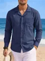 Close-up view of a men's navy blue long-sleeved cotton linen shirt in beach setting - Navy Blue