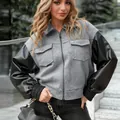 Veste courte élégante pour femme avec corps en laine grise et manches en cuir. - S / Hauts / Gris clair