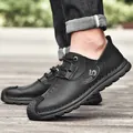 Modische Herren-Freizeitschuhe aus schwarzem Leder mit Schnürung und Gummisohle - 38 / Schwarz