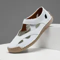 Side view detail of breathable white leather hollow out casual shoe with tan rubber sole - 38 / White
