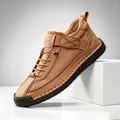 Close-up of tan leather casual shoe featuring manual stitching and SPORT logo detail - 38 / Tan