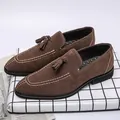 Classic brown suede men's loafers featuring tassels and elegant white stitching details - 38 / Brown