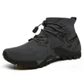 Side detail of a grey high-top outdoor hiking shoe with quick-lace toggle system. - 36 / Dark Gray