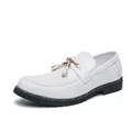 Elegant white patent leather men's loafers featuring gold tassels and a thick black sole - 38 / White
