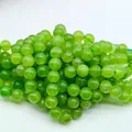 Vibrant green round gemstone loose beads for DIY jewelry making and craft projects - 6mm (Approx 62 Beads)/Strand / Peridot Crystal Color