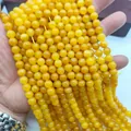 Hand-held premium quality vibrant yellow round quartz loose beads for jewelry DIY - 6mm (Approx 62 Beads)/Strand / Amber Yellow