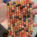 Multi-colored natural stone round loose beads held in hand for jewelry making - 6mm (Approx 62 Beads)/Strand / Champagne (Alashan)
