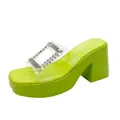 Macro view of lime green platform slide sandal featuring rhinestone buckle and clear strap - 36 / Green