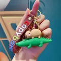 Schattige Capybara op krokodil siliconen sleutelhanger met kleurrijke decoratieve riem - Krokodil Stapelbare Capibara