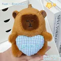 Cute capybara plush toy keychain holding a blue checkered heart charm for bags - Blue Heart / Brown