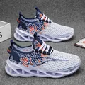 Breathable white men's mesh sneakers featuring thick shock-absorbing blade soles for sports - 40 / White Orange