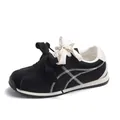 Women's casual black suede sneakers featuring white zig-zag stitching and dual thick laces - 35 / Black