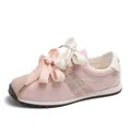 Pink suede sneakers for women featuring double ribbon laces and cross-stitch detail. - Pink