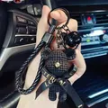 Detailed macro view of black handcrafted crochet bear keychain with ribbon and bell - Knitted Bear Style (With Strap and Bell) / Black