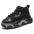 All-black men's chunky platform work shoe with textured thick sole and grey wavy design. - 39 / Black