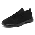 Breathable black fly-knit running sneaker for men in a sleek minimalist style - 35 / All Black