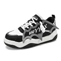 Trendy chunky platform skate shoes in black and white with unique bat wing detail - 39 / Black and White