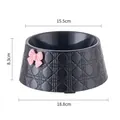 Black pet bowl featuring a pink bowknot and diamond quilted texture, 18.8cm base width - Pink Bow / Black