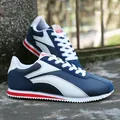 Baskets de course rétro bleu et blanc pour hommes avec semelle dentelée et touches rouges - 40 / Blanc Bleu Rouge