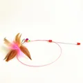 Detailed view of the steel wire cat teaser toy with feathers and bell - Steel Wire Feather