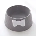 Close-up of a grey pet bowl featuring a diamond texture and decorative white bow - Single Piece / Gray