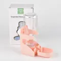 Detail of pink automatic pet waterer with clear suspended bottle and product box - Pink