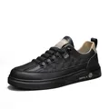Black men's casual sneaker with textured checkerboard pattern and tan lining detail - 39 / Black