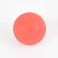 Close-up detail of red textured dog chew toy ball made of durable TPR elastic material - Large Size Solid Style / Red