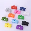 Close-up detail of bone-shaped pet waste bag dispensers in a wide variety of vibrant colors - Frosted Style / Empty Shell (No Bags) / White