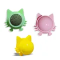 Cat-shaped wall-mounted catnip ball toys in vibrant green, pink, and yellow colors - Green