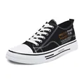 Stylish black low-top canvas sneakers for men featuring white laces and tech prints - 40 / Black