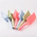 Colorful large plastic pet food scoops for cats and dogs shown in fanned arrangement - Large Scoop / Red