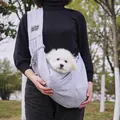 Close-up view of a grey comfortable pet sling carrier bag with a small white dog inside - Mesh Pocket Style / 75*50cm / Gray
