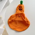 Detail view of orange fleece Halloween pumpkin pet cape with Jack-o'-lantern face and D-ring - S / Orange