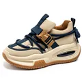 Beige chunky sneaker with navy straps and utility buckle, thick rubber sole. - 39 / Beige