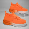 Vibrant orange knit slip-on sneakers with a comfortable thick gradient foam sole. - Orange Red